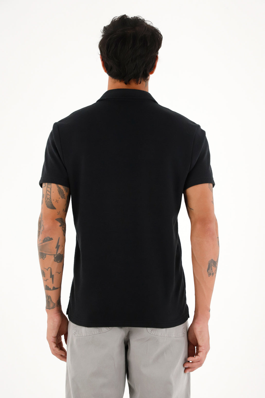 Polo negra en tela jersey con raqueta bordada para hombre